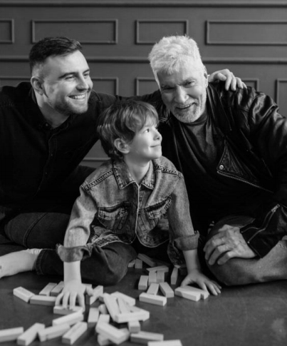 Father, son and grandson, smiling and playing